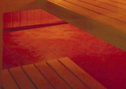 Posadzka w saunie wykończona jest terakotą, na której ułożono drewnianą kratkę