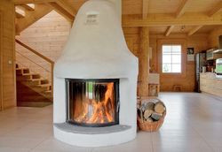 Parter ma charakter otwarty, a osią tej kondygnacji jest nowoczesny kominek wystylizowany na wiejski zapiecek