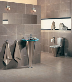 Stalowe sprzęty nadają łazience charakter nowoczesny, a wręcz industrialny