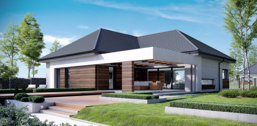 Dom na czasie: szary dach z płaskiej dachówki, drewno na elewacji, duży taras