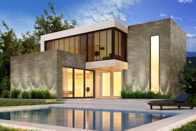 Betonowe bloczki i płytki o łupanej powierzchni dobrze naśladują kamień