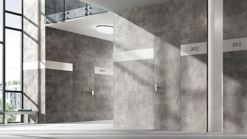 Betonowa faktura może znaleźć się na wszystkich ścianach lub tylko na jednej