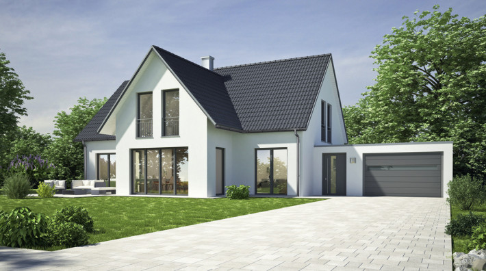 Budynek jednorodzinny z dachem spadzistym wielopłaszczyznowym, w którym zastyosowano system rynnowy Gamrat