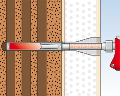Mocowanie markizy: Umieszczenie w otworze tulei perforowanej i wciśnięcie do niej zaprawy iniekcyjnej za pomocą pistoletu