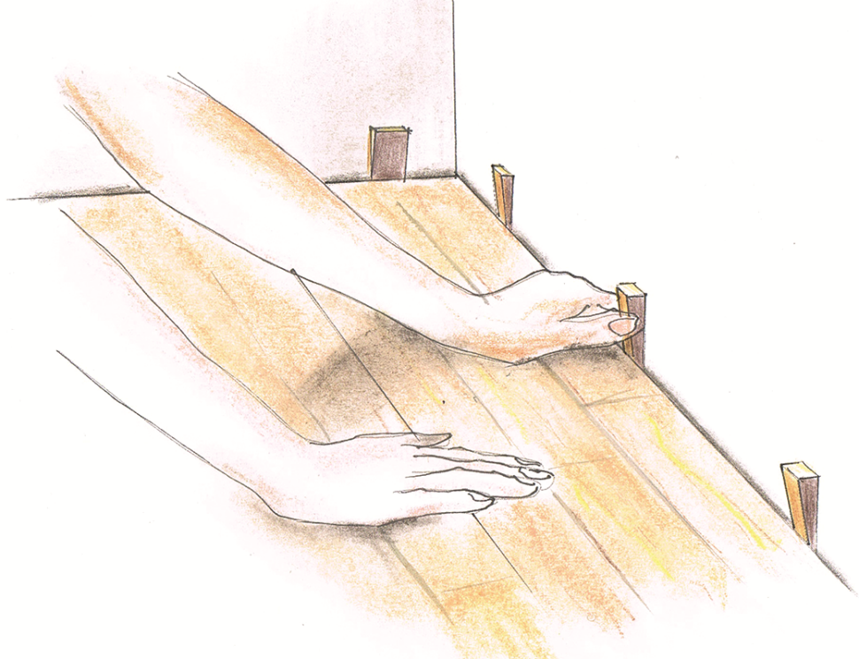 Rysunek: Za pomocą klinów dystansowych uzyskuje się szczelinę dylatacyjną na obwodzie posadzki