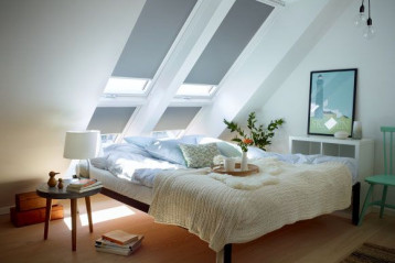 Białe prowadnice do rolet zaciemniających VELUX