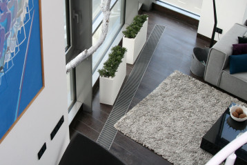 Loftowe wnętrza z grzejnikami kanałowymi