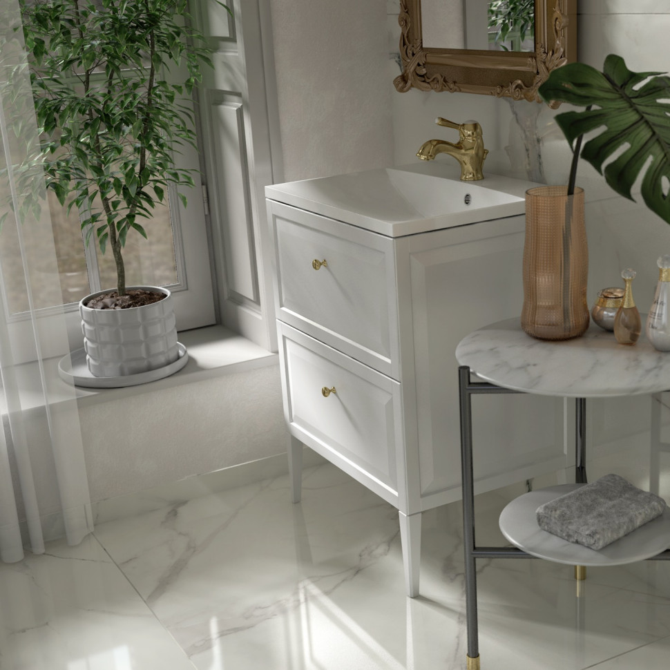 Biała szafka umywalkowa i złoty kran