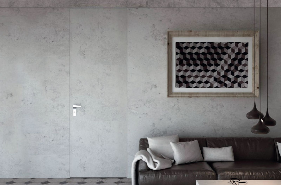 Drzwi z ukrytą aluminiową ościeżnicą i podwyższoną wysokością w modnym wykończeniu imitującym beton, takim samym jak na ścianie