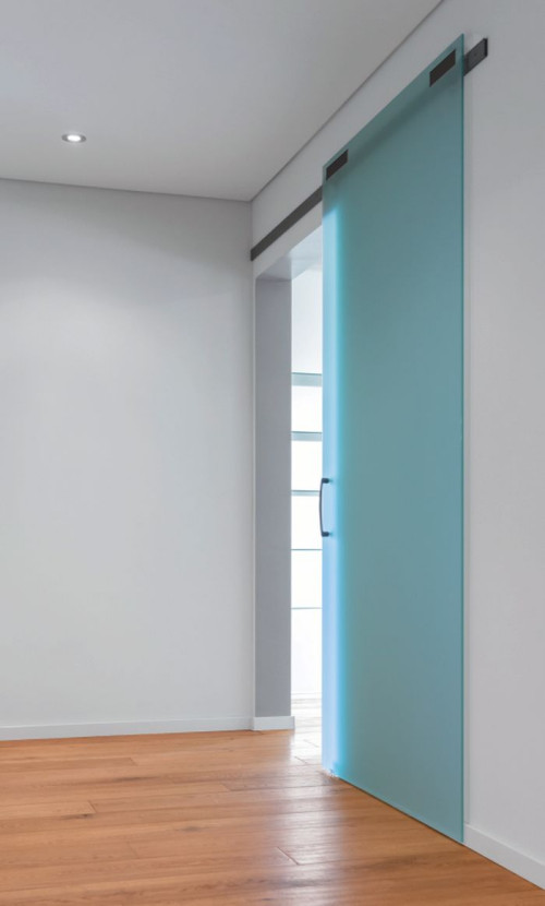 Szklane drzwi przesuwne naścienne