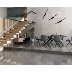 Efektowny szary salon ze schodami na antresolę - inspiracje