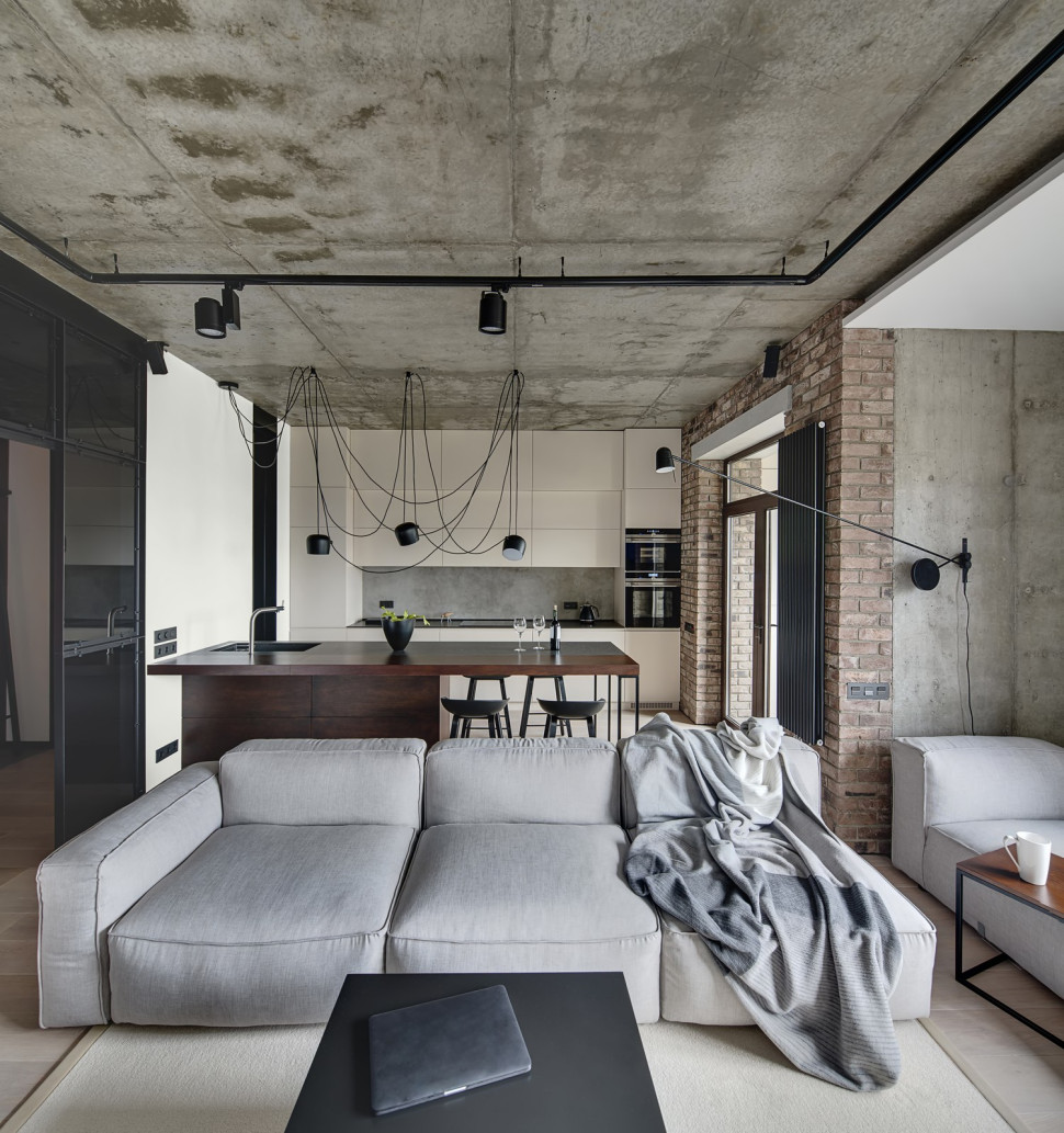 W loftowej kuchni jedną ścianę pomalowano farbą w kolorze B5 Czysta Biel z palety Magnat Ceramic Kitchen&Bathroom.