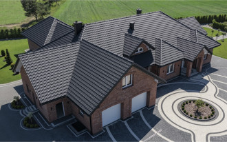 Jakie argumenty przemawiają za wykończeniem połaci dachówkami cementowymi?