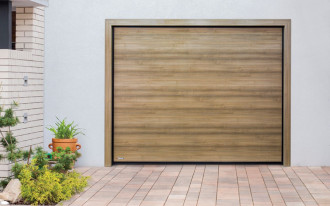 Dlaczego warto wybrać ciepłą bramę garażową?