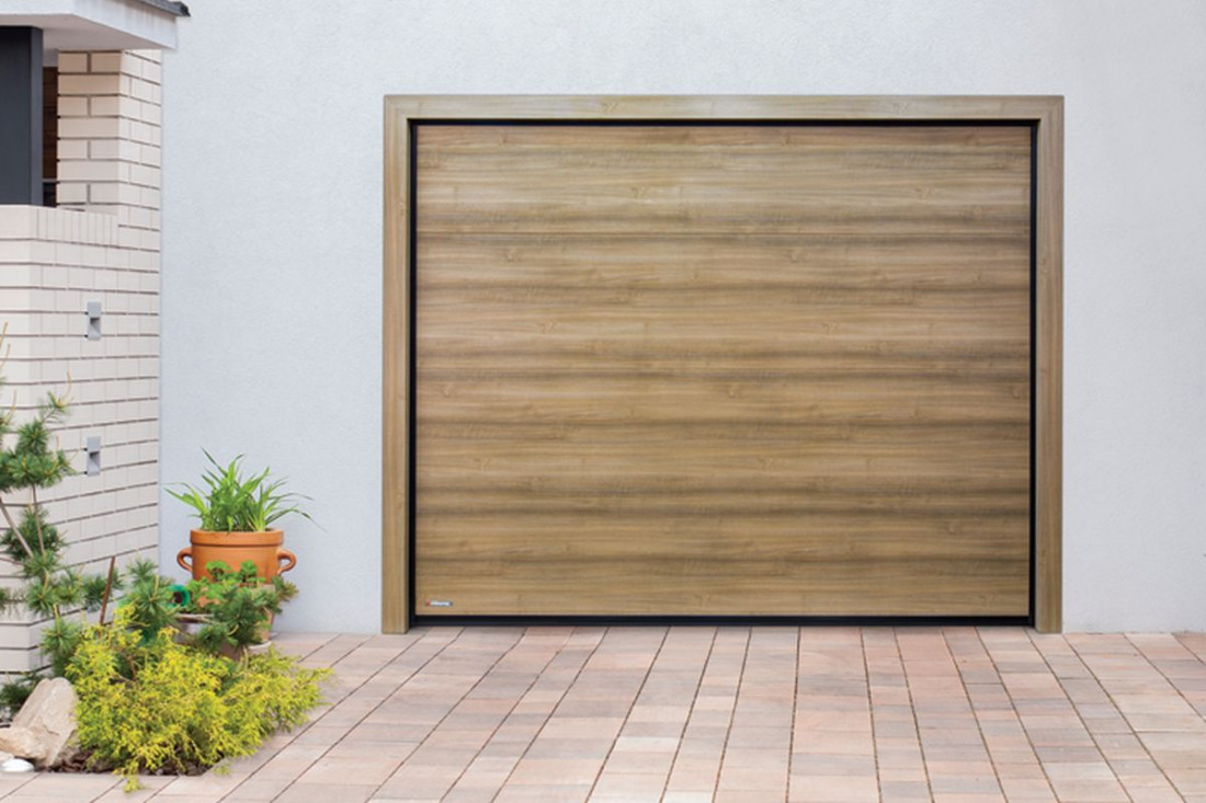 Dlaczego warto wybrać ciepłą bramę garażową?