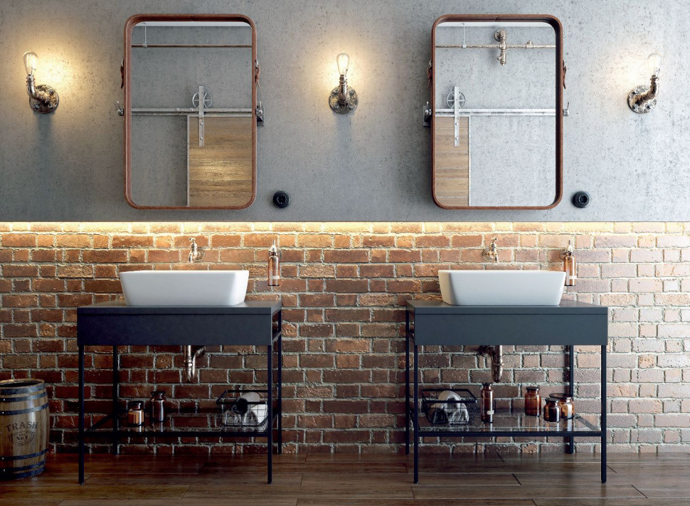 Prosta ceramika, stalowe konsole podumywalkowe Splendour, stylizowane lustra i dodatki na tle surowej cegły tworzą postindustrialny klimat wnętrza