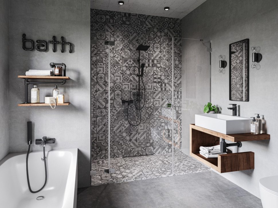 W jasnej kolorystyce, z tekstylnymi roletami, dywanem, grafikami, roślinami doniczkowymi i wazonem z kwiatami, z pewnością wiele kobiet poczuje się jak w raju. Z kolei kompozycja z mozaiką w strefie prysznica, w kolorach czerni i szarości, nawiązuje do industrialnego, bardziej męskiego charakteru łazienki