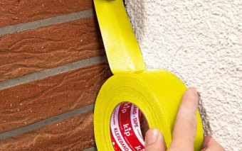 Która taśma naprawdę trzyma na betonie? Poznaj żółtą taśmę tkaninową do muru