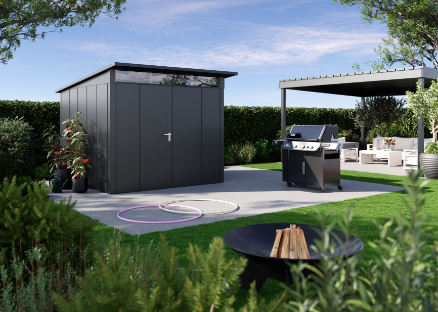 Domek Juno Design z dachem jednospadowym. Jego nowoczesny i elegancki charakter podkreślają szerokie, pionowe segmenty ścian