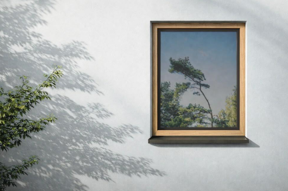 W połączeniu z ościeżnicą o naturalnym, drewnianym wyglądzie, czarne skrzydło Schüco LivIng Panorama staje się tylko smukłym konturem. Fot.: Schüco